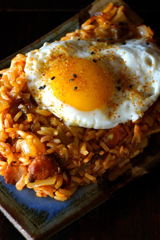 Kimchi-Bacon Fried Rice with an egg and black sesame seeds on top