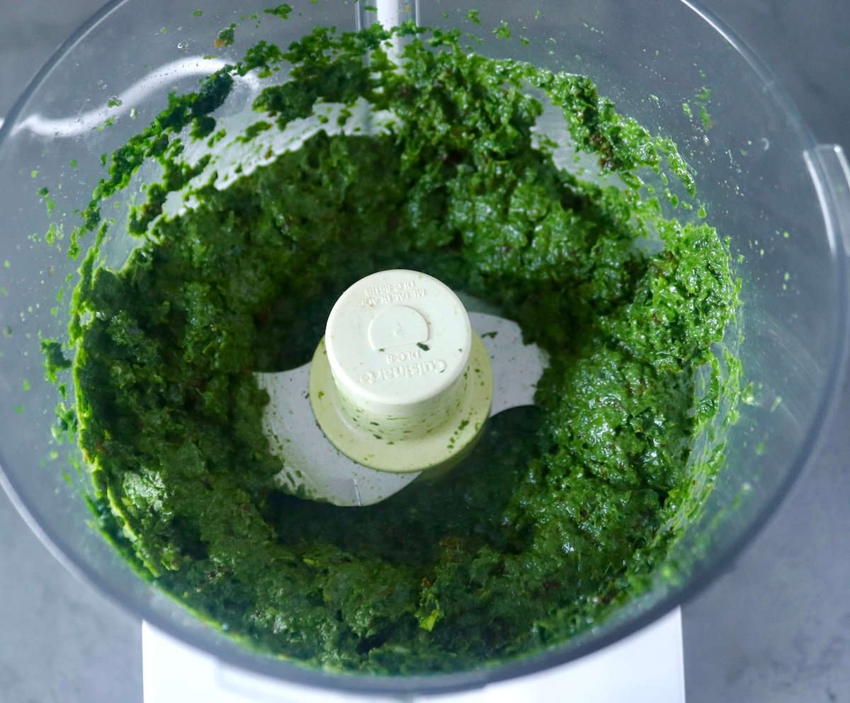 Spinach-Basil pesto in a food processor bowl.