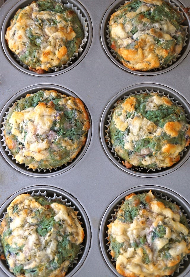 6 purple Sweet Potato Muffins still in the muffin tin, that have turned green.