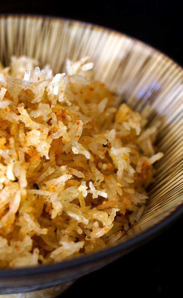 Spicy Crispy Rice in a striped beige bowl.