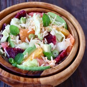 wooden bowl on wood background with wasabi pickled ginger salad with blood oranges