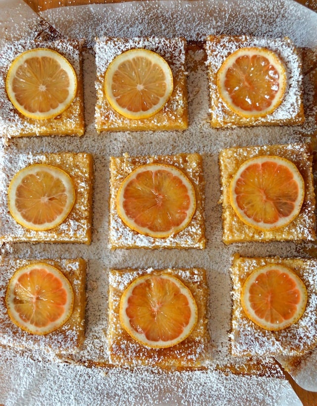 Top view of 9 cut Gluten-Free Lemon Bars with Coconut Crust with powdered sugar