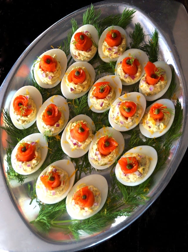 Salmon Deviled Eggs with fresh dill on a silver platter