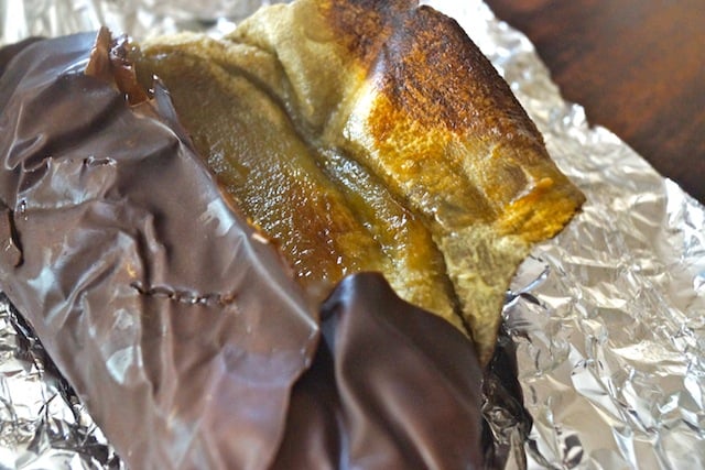 roasted eggplant on foil with skin peeling off