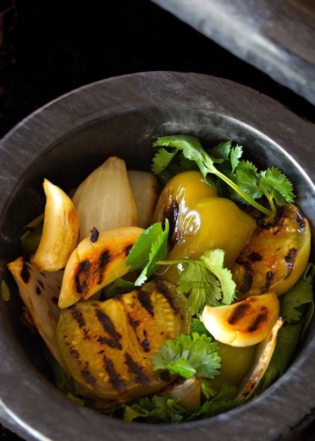 Salsa Verde ingredients in mortar with pestle