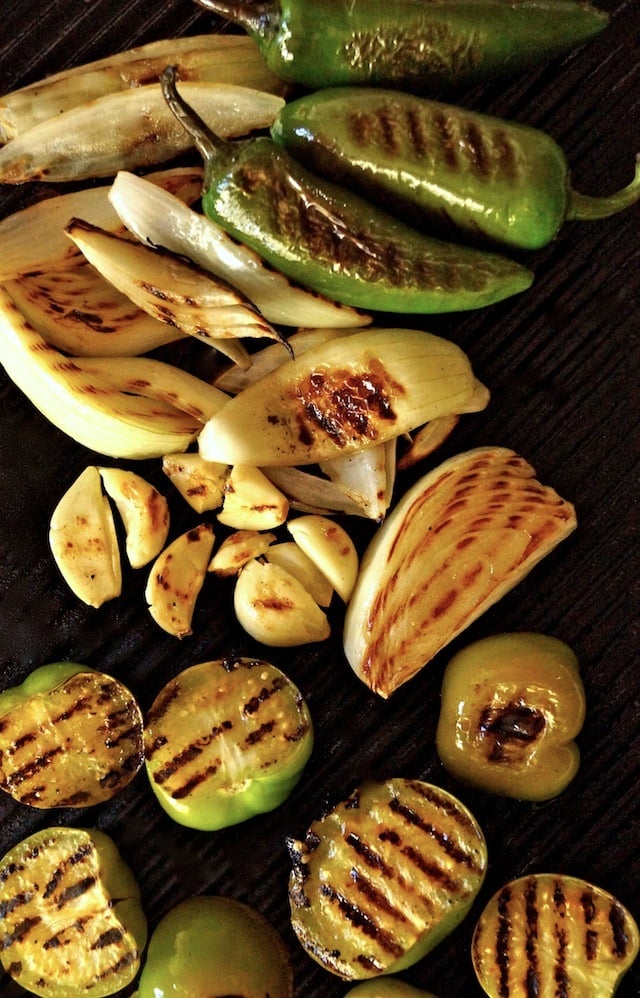 Salsa Verde Recipe ingredients on a grill with char marks