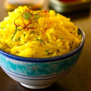 small bowl overflowing with saffron rice