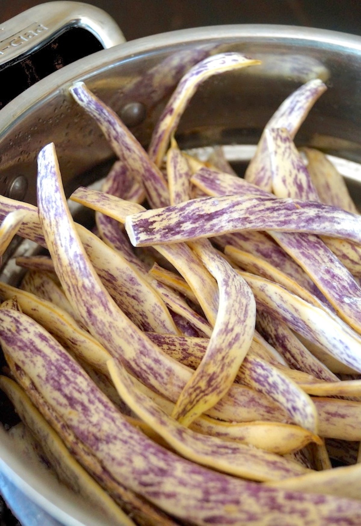 Raw Dragon Beans in a steamer pot.