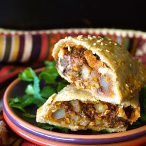 Chorizo-Potato Spiced Sesame Hand Pies -- It's packed with Cacique® Pork Chorizo, Cacique® Panela cheese and creamy potatoes -- and it's all inside a flaky, buttery, sesame crust. One won't be enough!