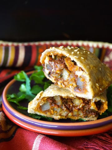 Chorizo-Potato Spiced Sesame Hand Pies -- It's packed with Cacique® Pork Chorizo, Cacique® Panela cheese and creamy potatoes -- and it's all inside a flaky, buttery, sesame crust. One won't be enough!