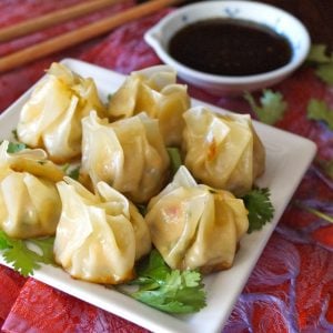 Garlic Ginger Chicken Dumpling Recipe (Momo) - Juicy chicken, flavorful vegetables and aromatic garlic and ginger in every bite! The perfect hors d'oeuvres or appetizer that you won't be able to stop eating!