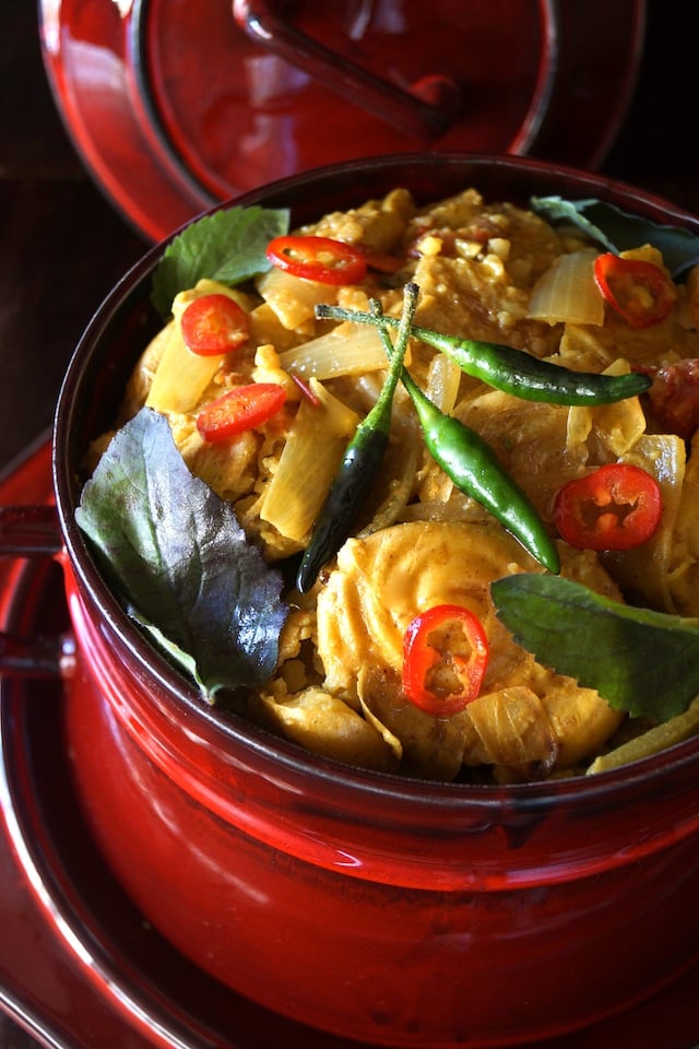 Curried Smashed Potato Stew in beautiful red pot with lid in background