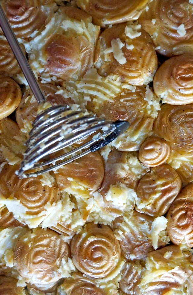 Dutch Yellow Potatoes being smashed for Curry Smashed Potato Stew recipe.