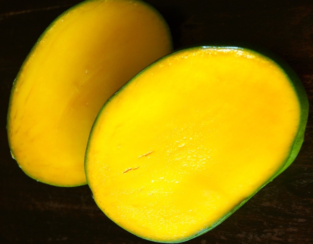 One Keitt Mango sliced in half.