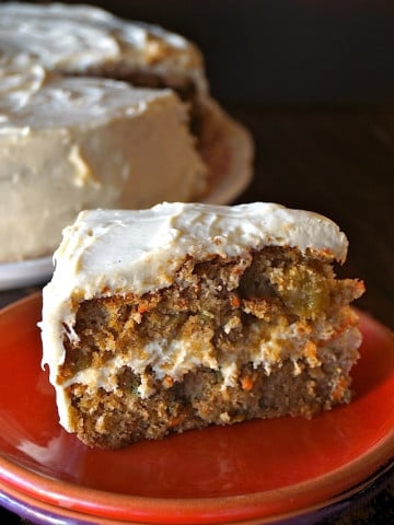 Gluten Free Spiced Carrot Cake Recipe with Cardamom Cream Cheese Frosting -- Filled with warm spices, sweet carrots and golden raisins, this is the perfect celebration cake for fall.