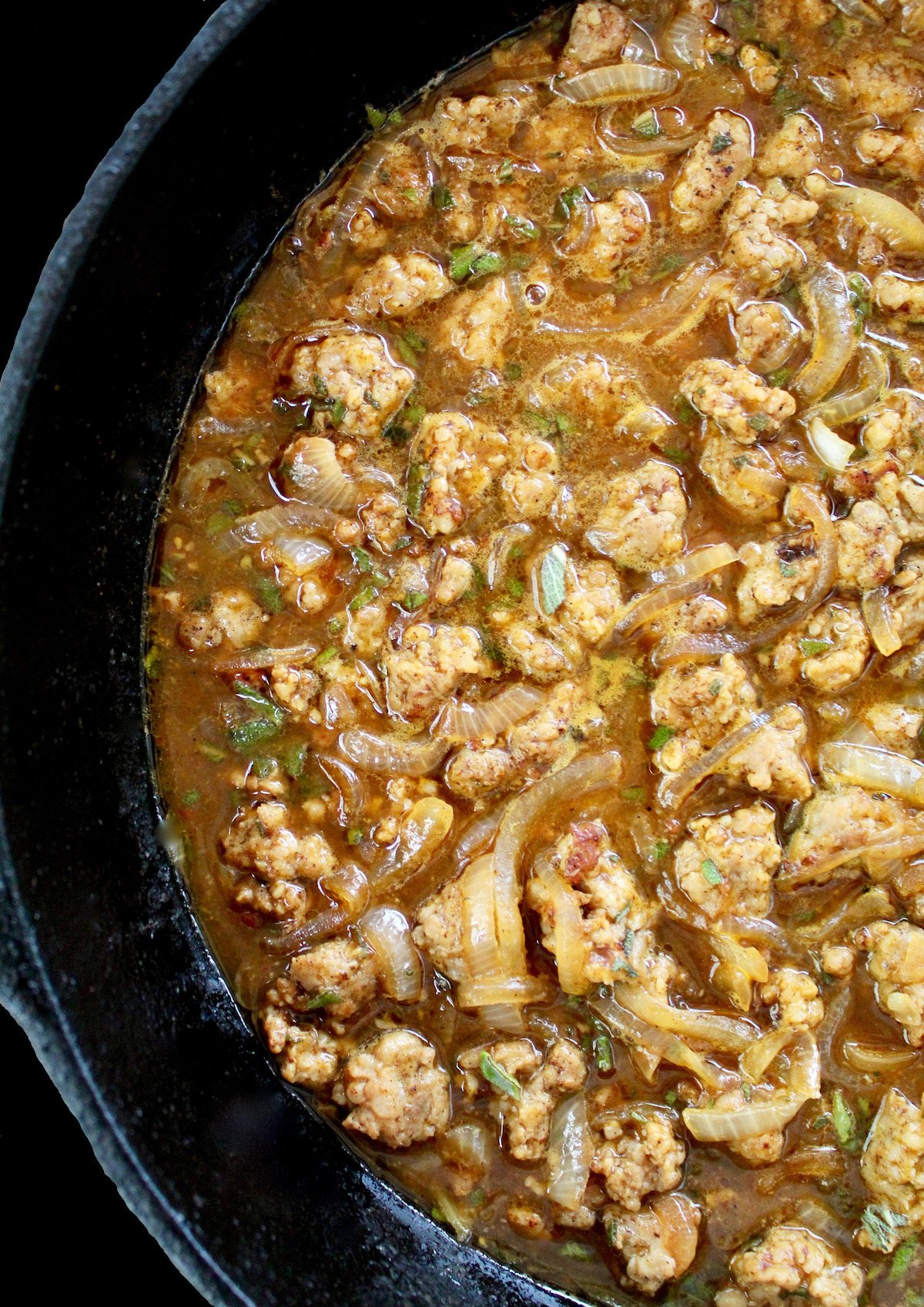 pumpkin pasta sauce with sausage in cast iron skillet