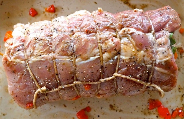 rolled, stuffed, raw pork loin with twine