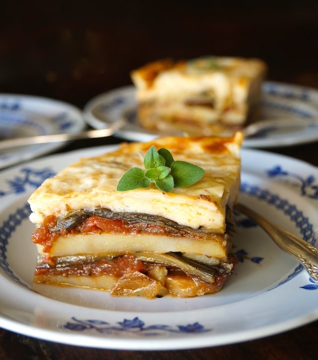 slice of Potato Moussaka on a white plate with blue flowers