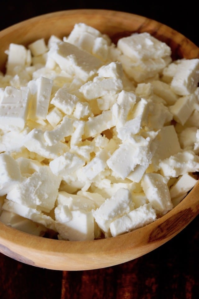 wooden bowl filled with chunks of Feta cheese