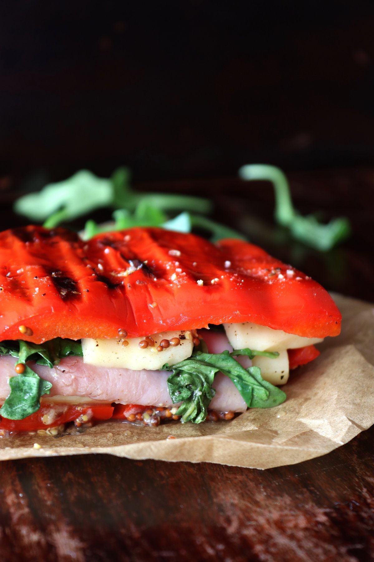 grilled red bell pepper sandwich on parchment