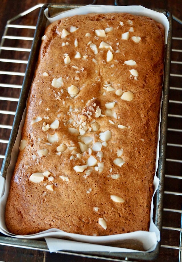 baked loaf of Gluten-Free Macadamia Honey Bread on cooling rack