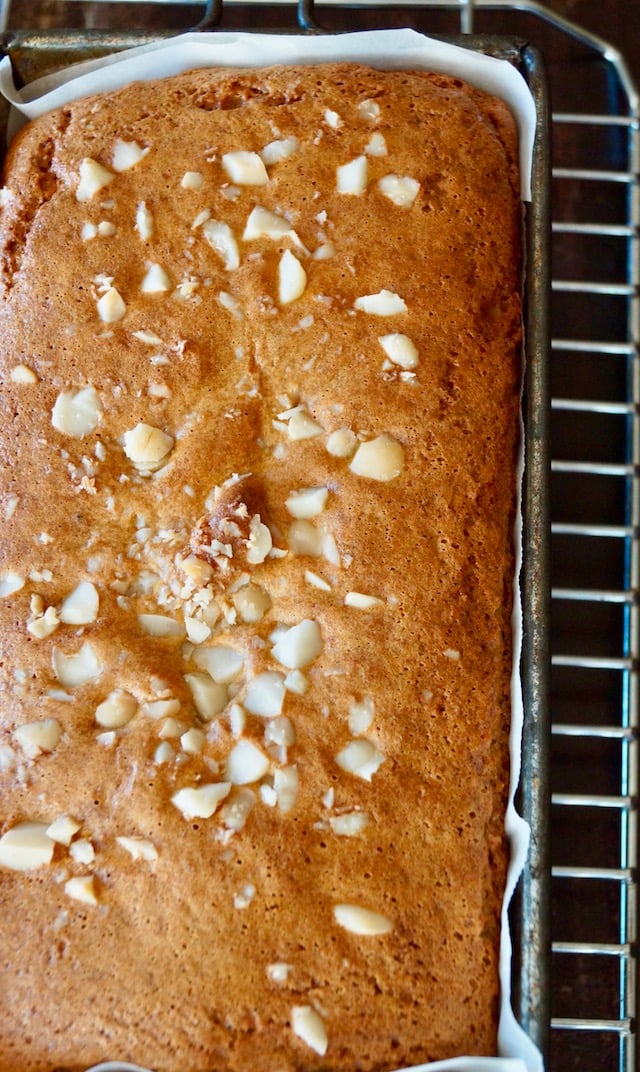 baked loaf of Gluten-Free Macadamia Honey Bread on cooling rack