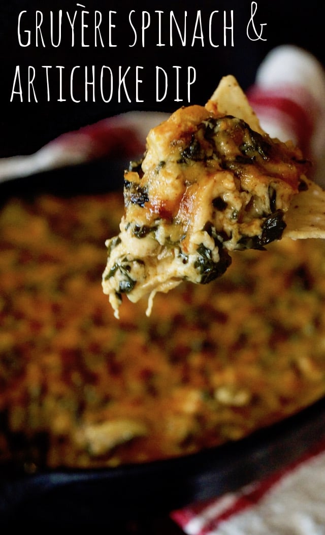 Gruyère Spinach Dip Recipe with Spices and Artichokes with one big bit on a chip.