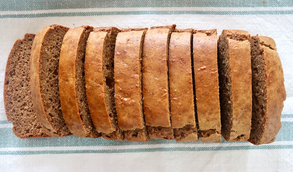 Top view of sliced loaf of almond butter bread.