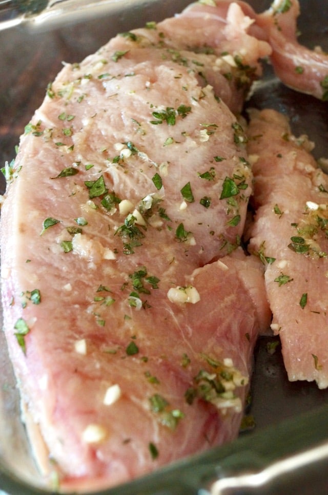 raw albacore with finely chopped fresh herbs and garlic