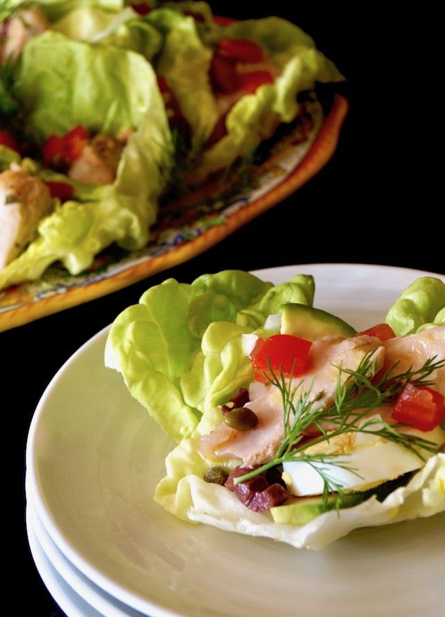 Nicoise Salad Cups with Honey-Lemon Dressing on a small white plate