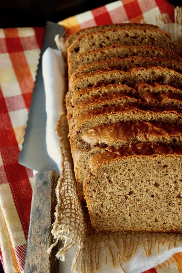 Gluten-Free Almond Butter Bread slices with serrated kinfe on the side