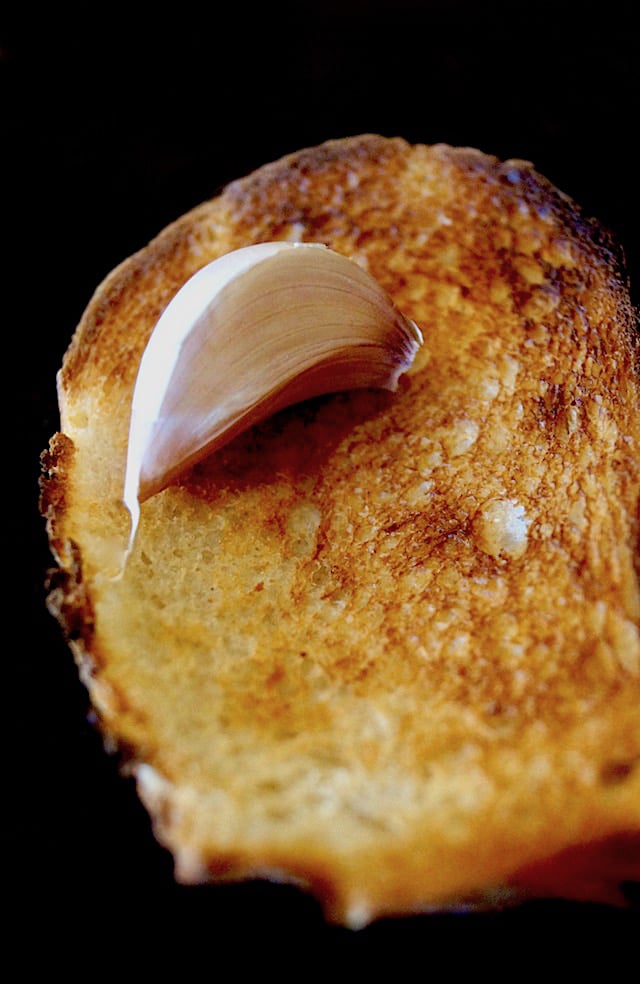 Plain toast with one garlic clove on top, not peeled