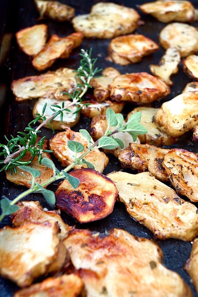 Herb Roasted Sunchokes with fresh rosemary and oregano sprigs