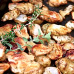 Roasted Sunchokes with fresh herbs on baking sheet