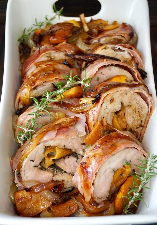 Persimmon Prosciutto Pork Tenderloin with fresh rosemary sprigs