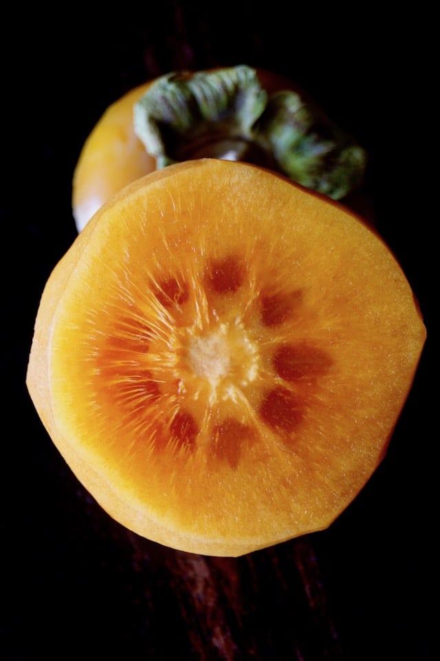 Fuyu persimmon sliced in half