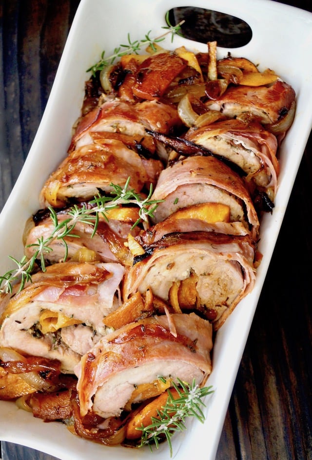 Persimmon Prosciutto Pork Tenderloin with fresh rosemary sprigs