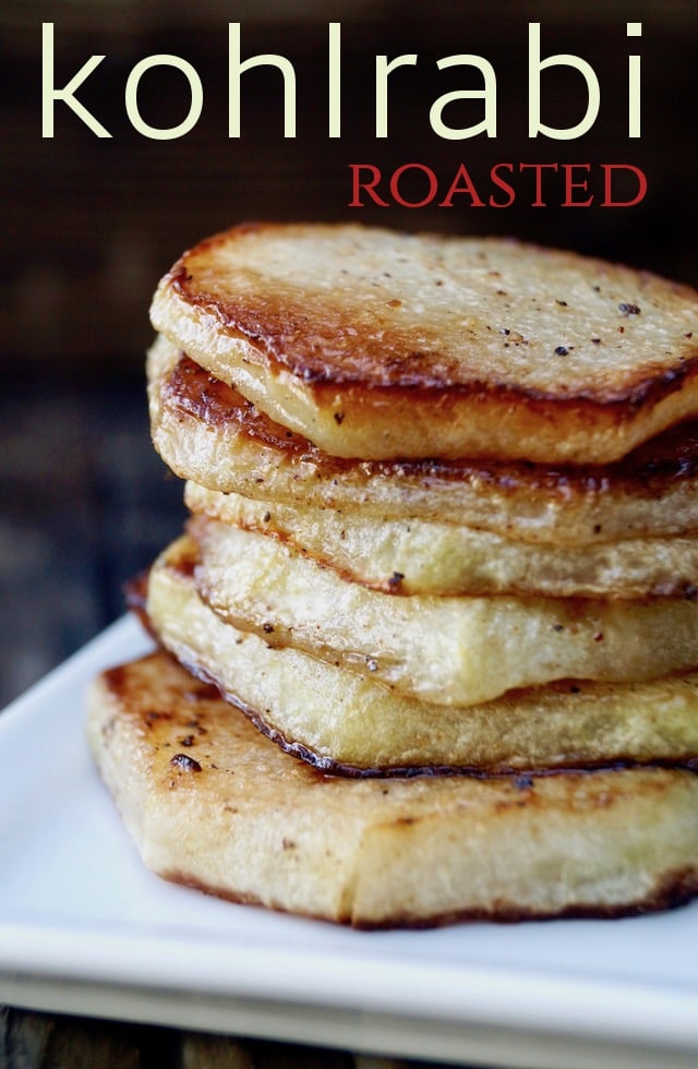 Stack of several Roasted Kohlrabi slices on a white, square plate.