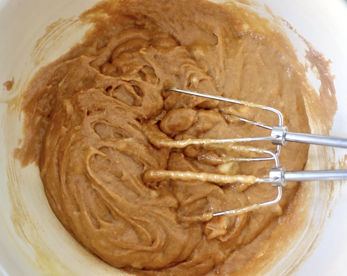 Peanut Butter Banana Muffin batter before adding the egg whites and chocolate chips, with the mixer beaters in the bowl. 