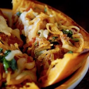 stuffed spaghetti squash cut into wedges