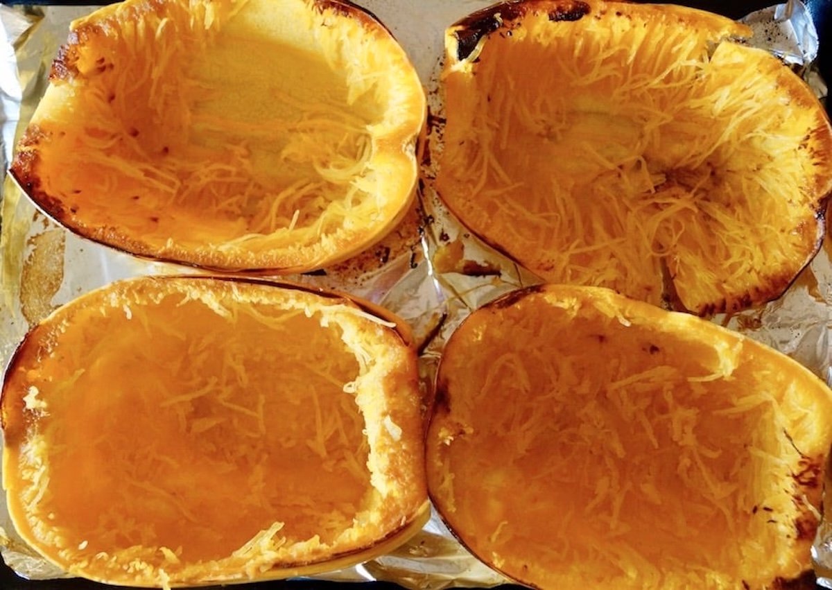 4 emptied spaghetti squash halves.