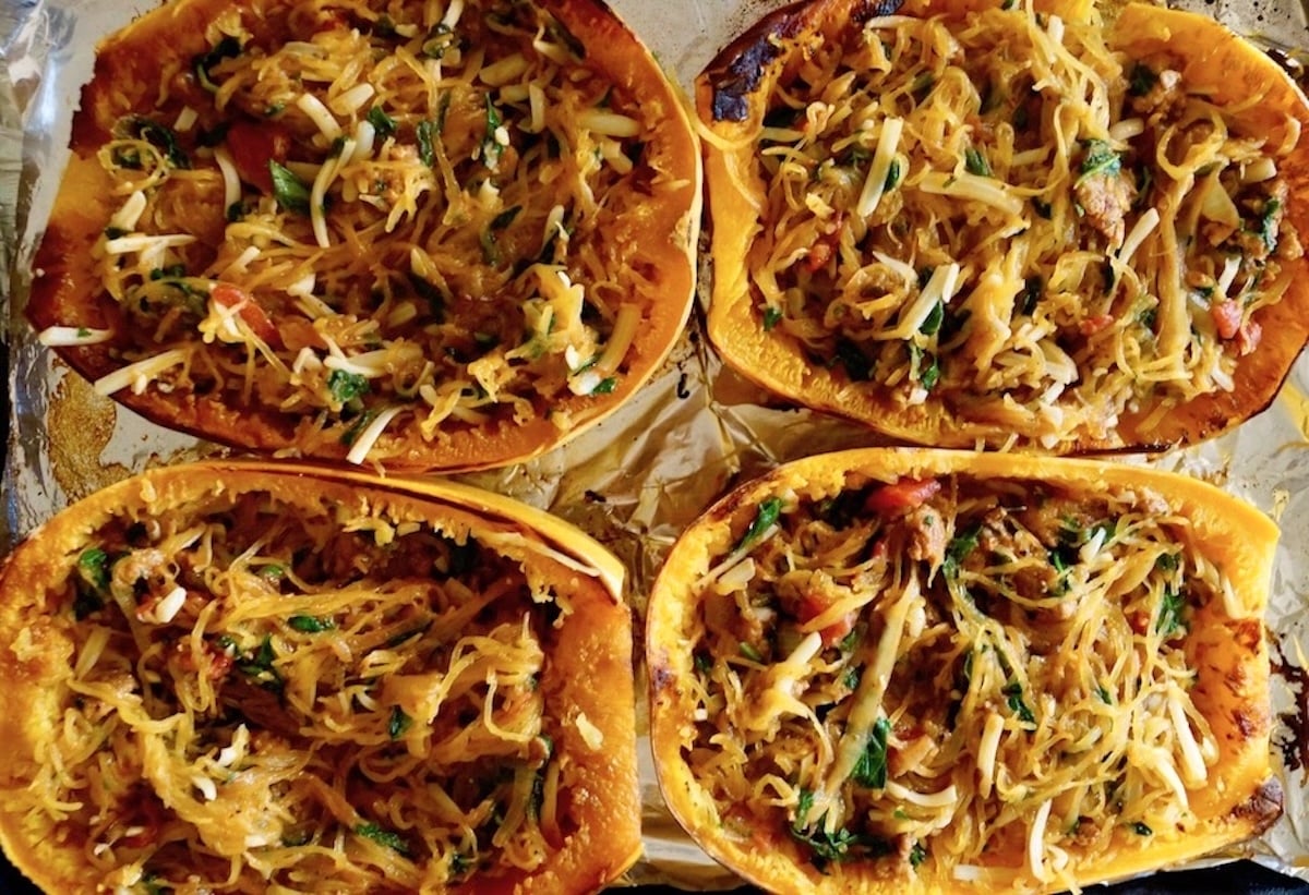 4 spaghetti squash halves filled with squash, sausage and spinach.