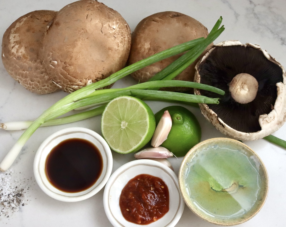 Marinated-Grilled-Portobello-Mushrooms Ingredients for marinated portobello mushrooms including scallions, soy sauce, garlic, chili paste and oil.