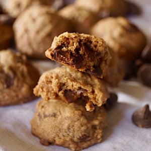 3 stacked Mexican Chocolate Spice Cookies on a white cloth napkin.