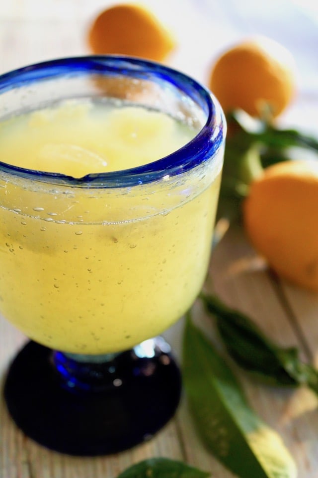 blue-rimmed glass with lemonade