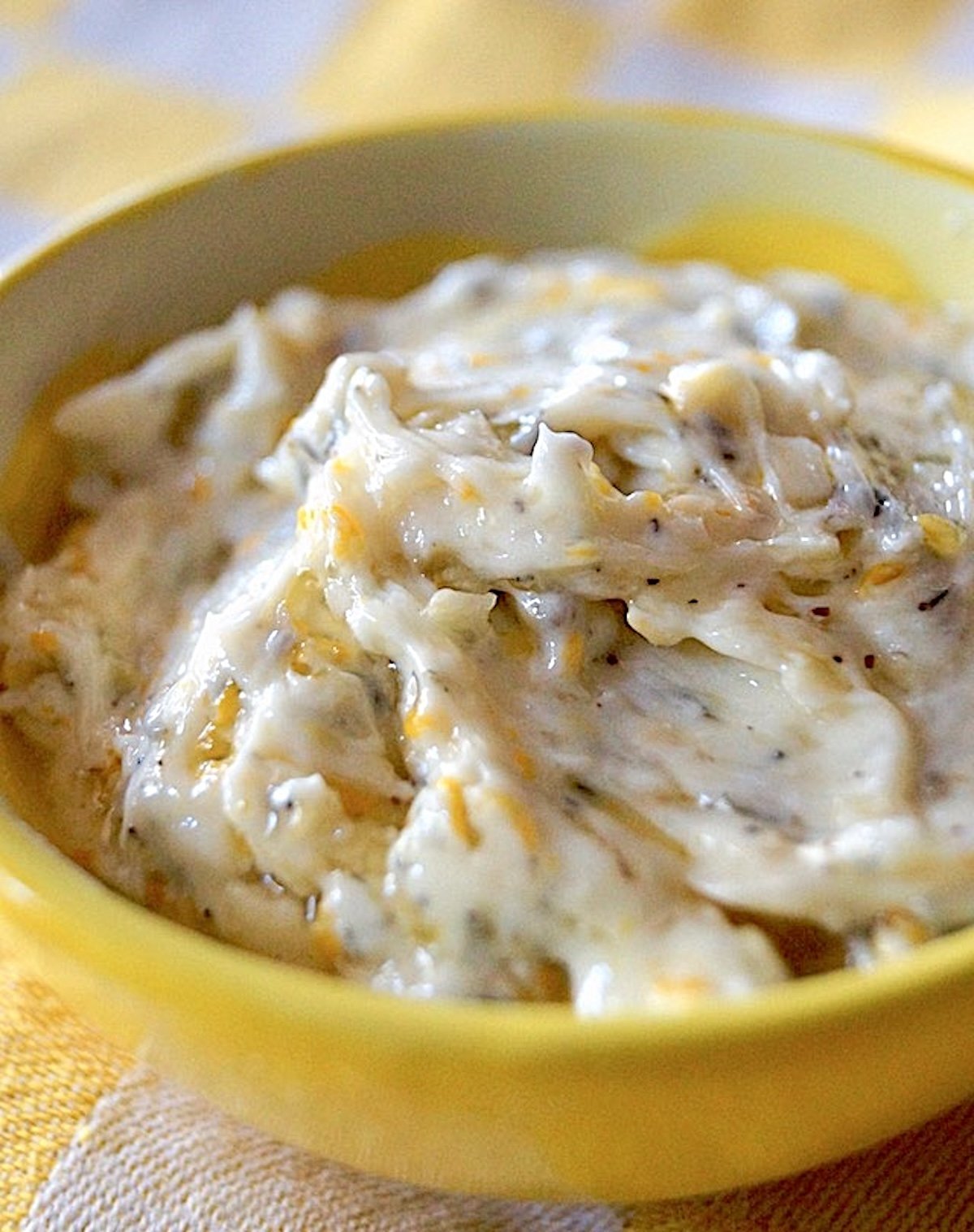 Small yellow bowl with a lemon compound butter.