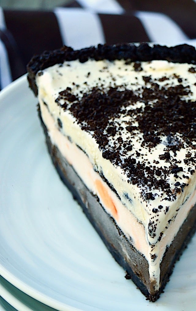 Close up of a slice of Chocolate Peppermint Ice Cream Mud Pie on a white plate.