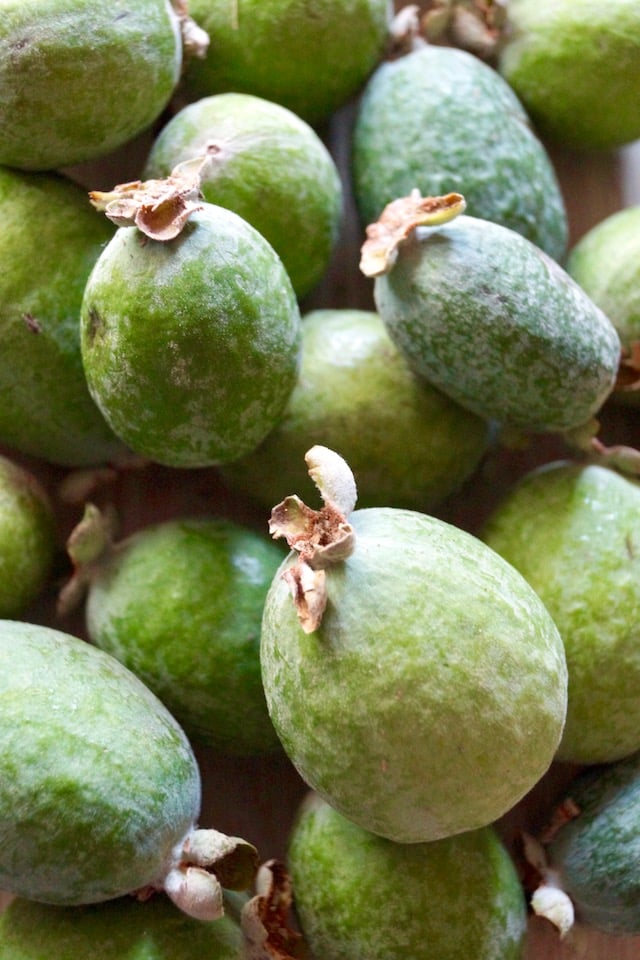 Pile of green pineapple guavas.