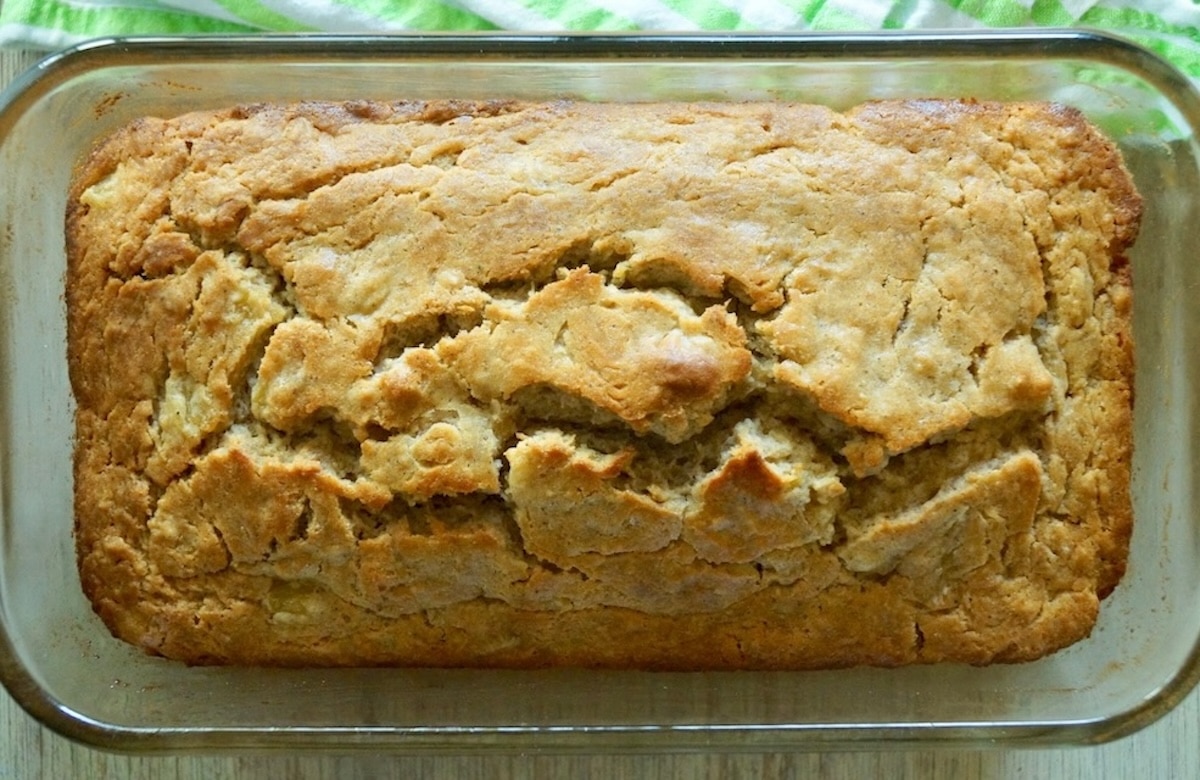 Glazed-Pineapple-Guava-Bread Baked loaf of pineapple guava bread in glass bread dish.