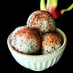 3 large scoops of dragon fruit with pomegranate glaze in a white bowl